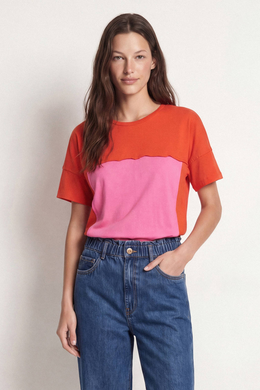 Two-tone red and pink shirt on a light gray background